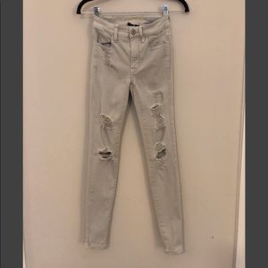 Very soft pale grey skinny destructed jeans